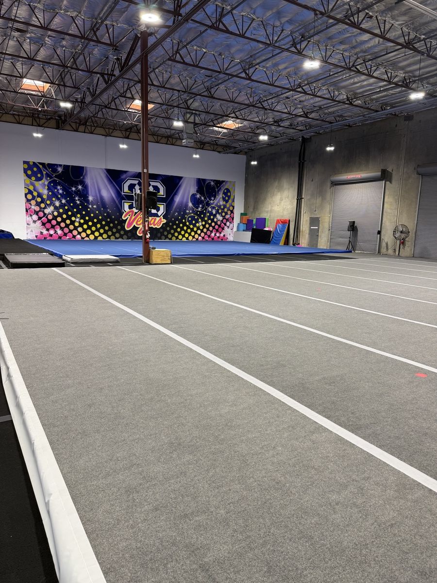 Open gym floor with spring floor panels and exposed insulated roof, CheerCats tenant improvement, Henderson NV