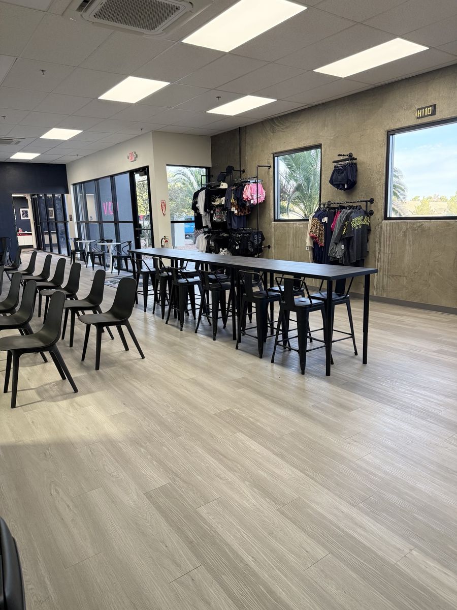 Seating area with tables and chairs, LVP flooring and exterior windows, CheerCats tenant improvement, Henderson NV