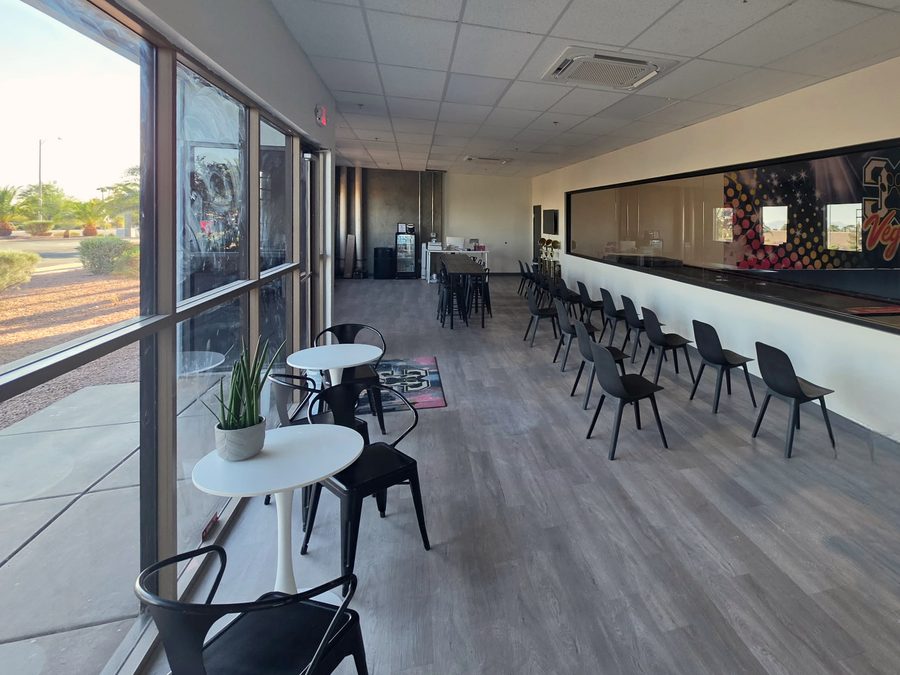 Viewing lounge with a large window into the gym, LVP flooring, drop ceiling and seating, CheerCats tenant improvement, Henderson NV