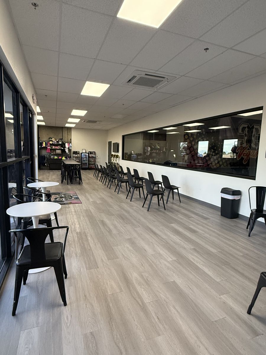 Viewing lounge with cafe seating, drop ceiling lighting and windows into the gym, CheerCats tenant improvement, Henderson NV