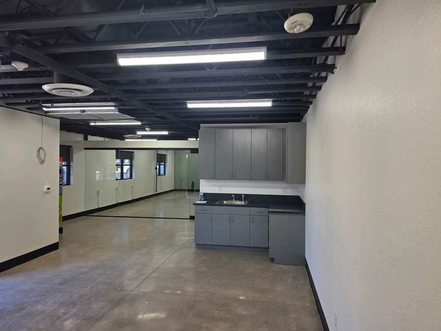 Exposed steel deck ceiling and concrete floor in the Sustain Vegas commercial interior, Las Vegas NV