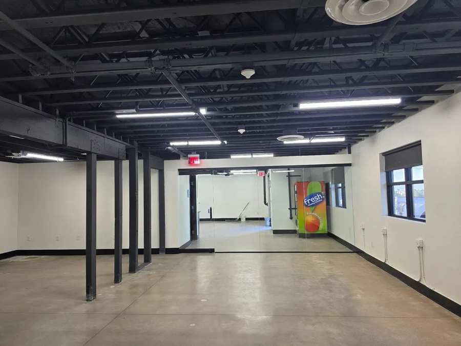 Open-plan office tenant improvement with exposed black steel ceiling and polished concrete floor, Sustain Vegas, Las Vegas NV